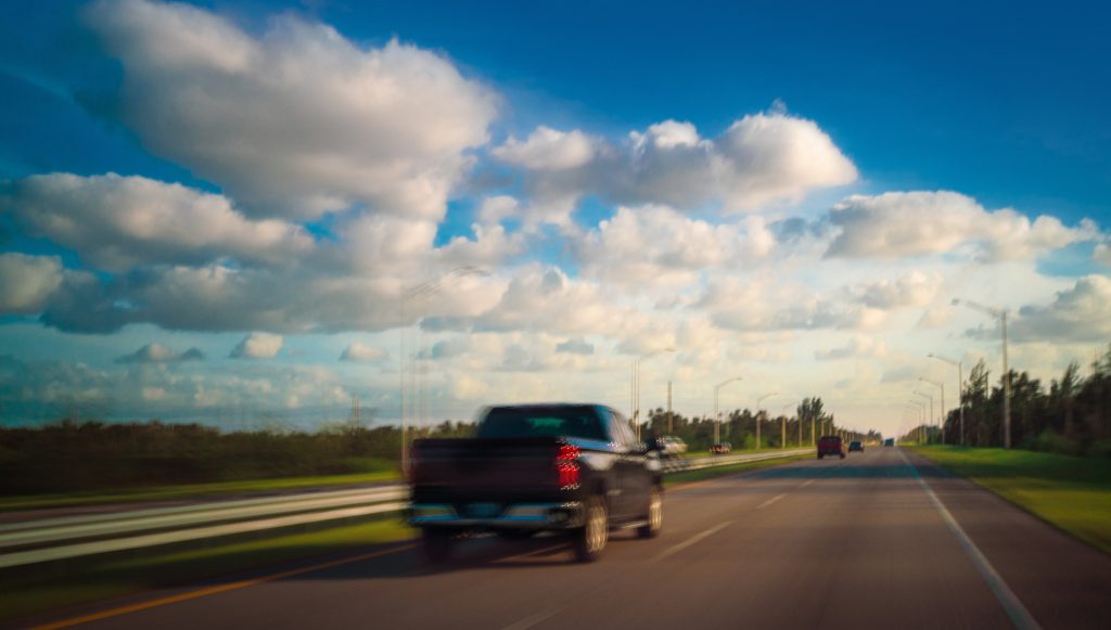 Truck traveling on the highway, reflecting a Tempur Sealy Hospitality sales representative’s commitment to personally supporting customers.